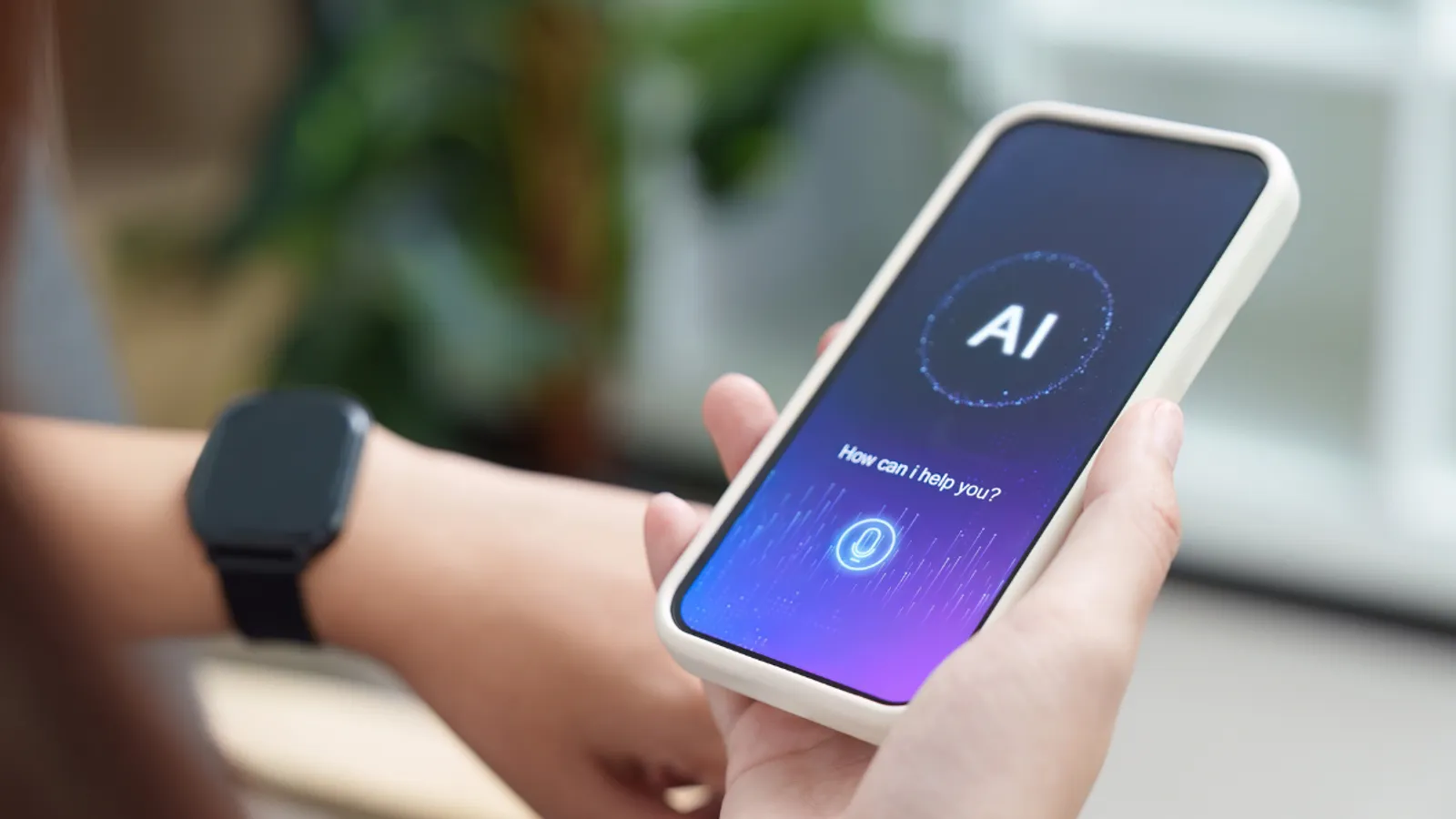A person holding a smartphone displaying an AI assistant interface with the prompt "How can I help you?"