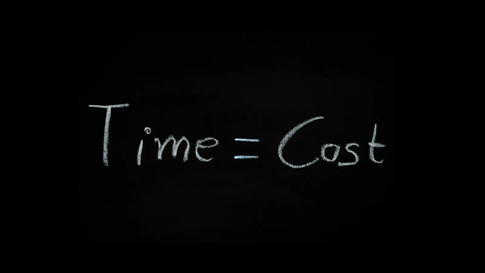 "Time equals Cost" written in chalk on a blackboard